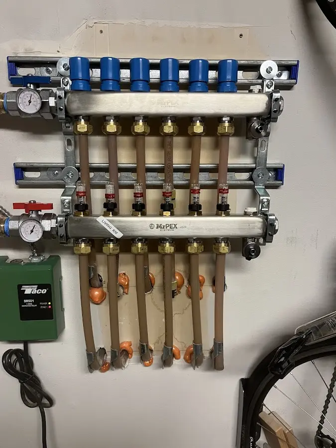 Plumber performing Leak Detection at a residential property in Tontitown